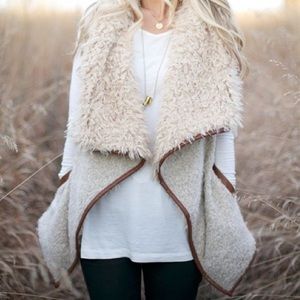 Open front sherpa vest with pockets.